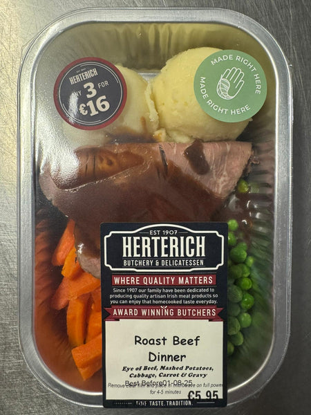 Herterich Roast Beef Dinner ready meal with beef, mashed potatoes, carrots, peas, and gravy in a clear plastic container.