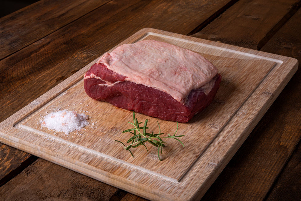 Herterich's Striploin Roast Beef on wooden platter