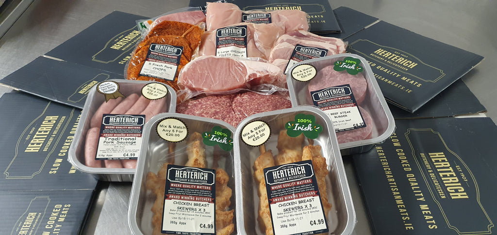 Herterich Meat Feast Hamper contents, showing packaged Irish pork, chicken, and sausages