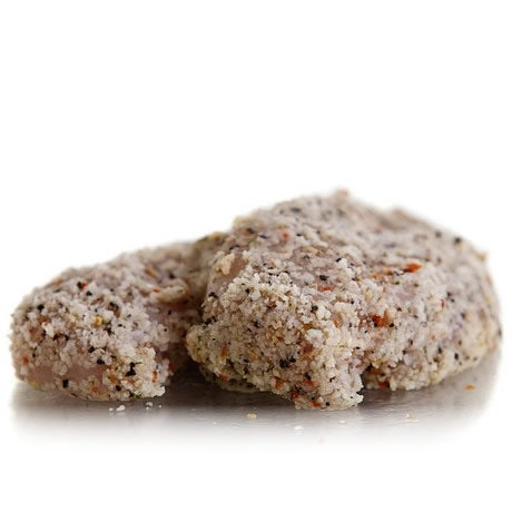 Two raw Chicken Fillets coated in a golden Texas Pepper crumb, with a tangy lemon spice flavour.