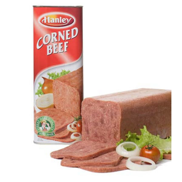 Packaging and sliced pieces of Hanleys Corned Beef, with lettuce and tomato garnishes.