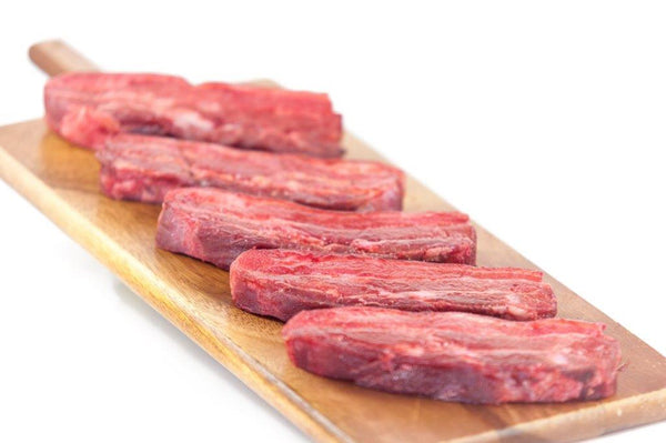 Three raw Chinese Glazed Pork Belly Chops on a tray, made from locally sourced, free-range pork.Ireland