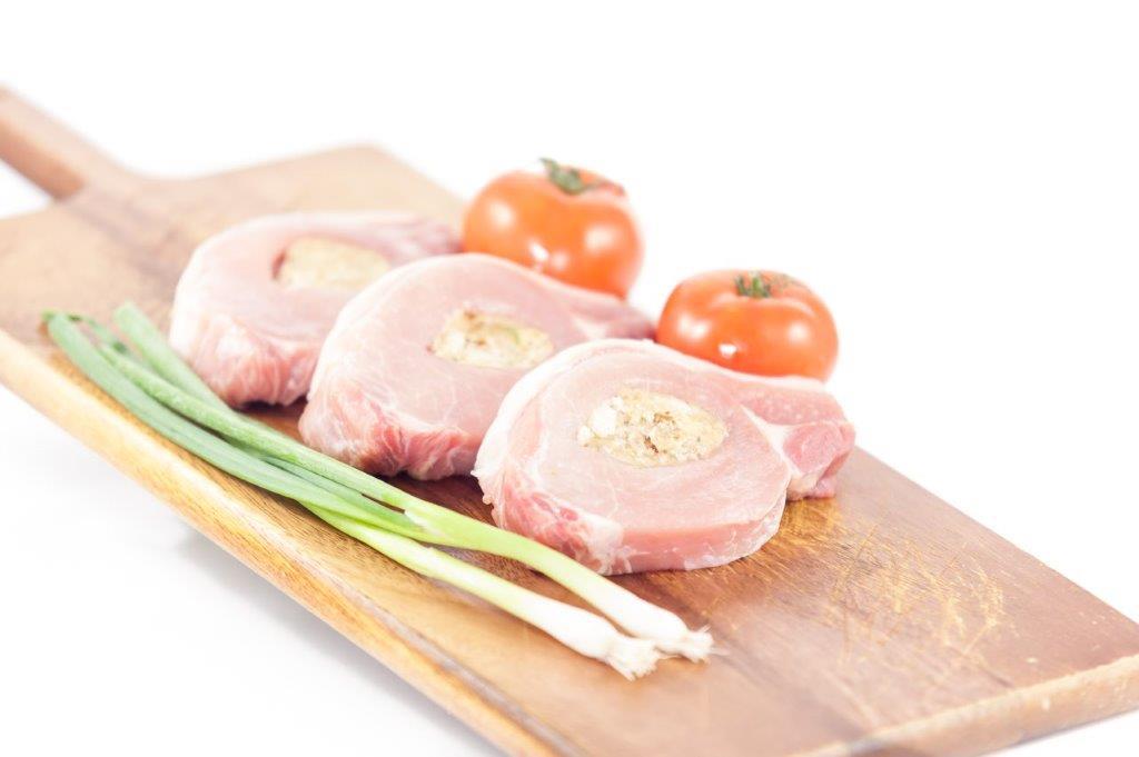 Herterich Stuffed Pork Chops on a wooden platter
